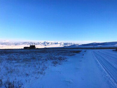 Looking SE across corner of Lot down Lasso Trail