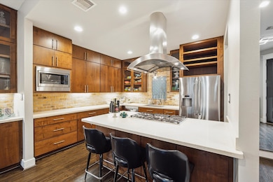 Modern chef’s kitchen featuring an oversized islan