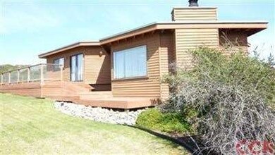 Decks nearly surrounding this home make outdoor en