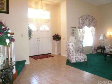 Grand double door entry with soaring ceilings and 