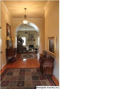 High ceilings and Arched Doorway into Living Room