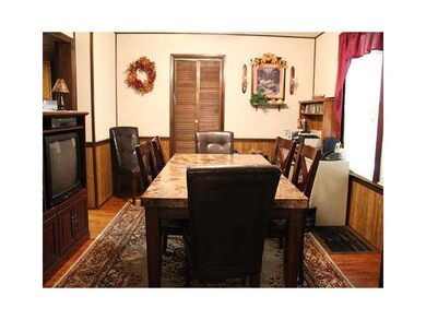 Dining Room. Hard wood floors and pocket door to l