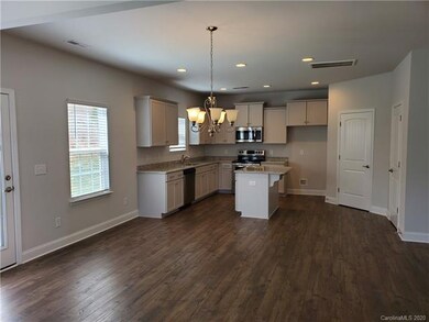 Dining area and kitchen ~ photo representation