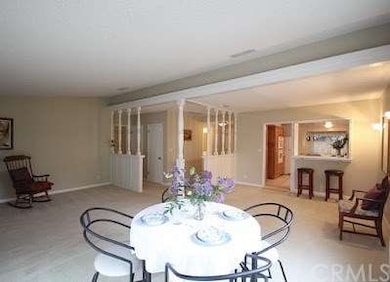 Living room looking towards kitchen and front entr