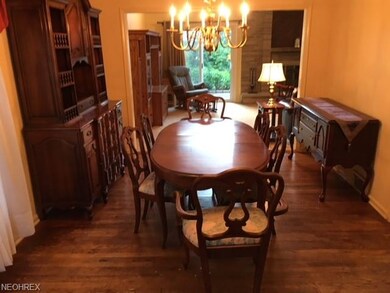 FORMAL DINING ROOM LOOKING INTO FAMILY ROOM.