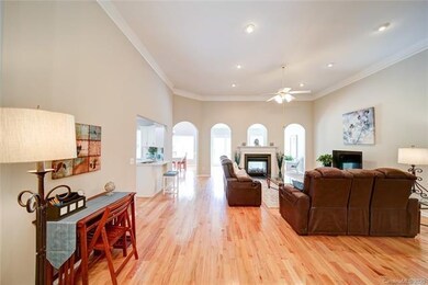 Sunlit open great room with double sided gas firep