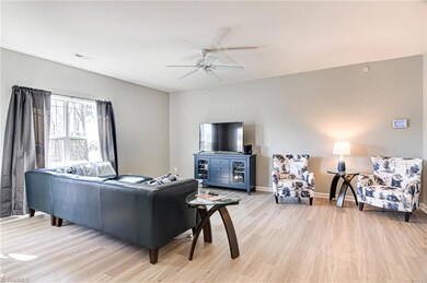 Spacious Living Room with ceiling fan.