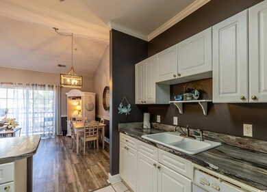 Kitchen featuring decorative light fixtures, an in