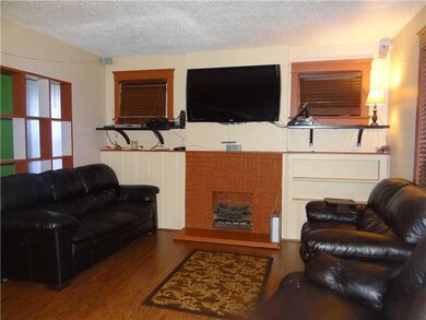 Living Room. Cozy from the Hardwood floors to the 