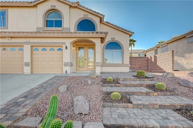 Mediterranean / spanish-style home featuring stucco siding, concrete driveway, a tiled roof, and an attached garage