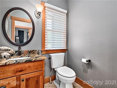 Main floor half bath is located near the foyer and
