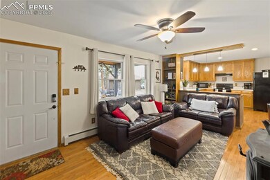 Cozy and inviting, the living room centers around a wood-burning fireplace—perfect for cool mountain nights.
