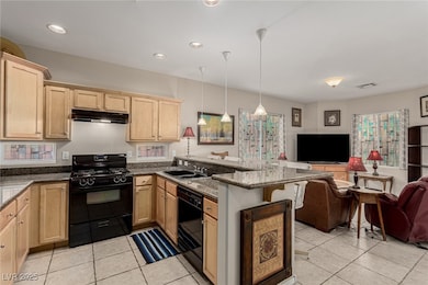 Kitchen with open floor plan, granite counters and