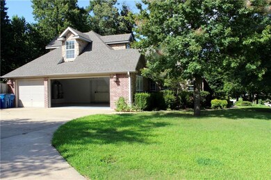 Side of home with driveway leading to 3 car garage.