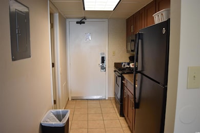 Kitchen featuring black appliances, a paneled ceil