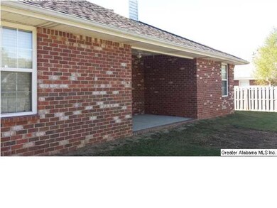 Back view Full Brick with covered Patio