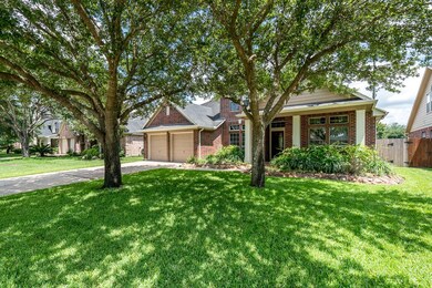 Mature trees give shade to this beautiful home.