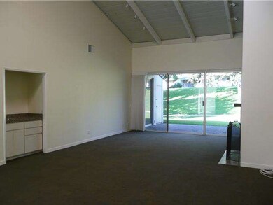 Huge living/dining room has a fireplace and wet ba