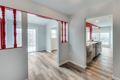 Living room looking into kitchen and dining rooms