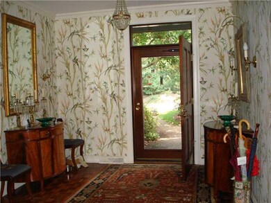 Entry/Foyer. Gracious parquet entry with sconces