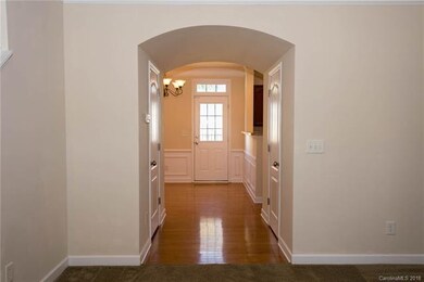 Hallway leading into kitchen and dining room. Hall
