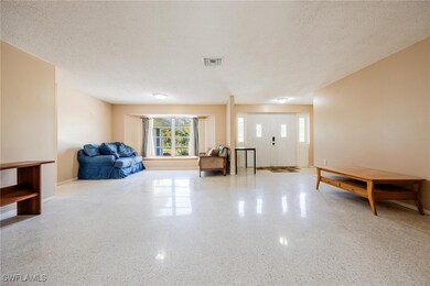 Living area featuring a textured ceiling