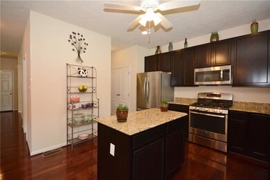 The equipped kitchen offers granite countertops, c