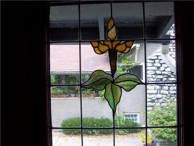 Foyer Stained & leaded glass window brightens fron
