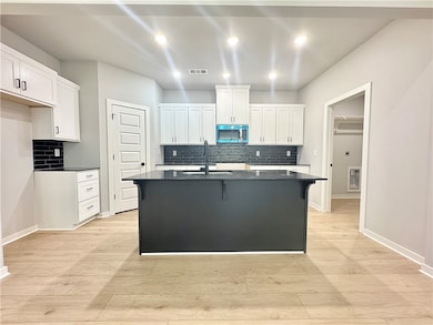 The quartz countertops, walk-in pantry, and stainl