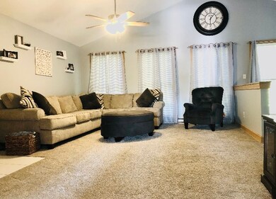 Great Room w vaulted ceilings and lots of natural