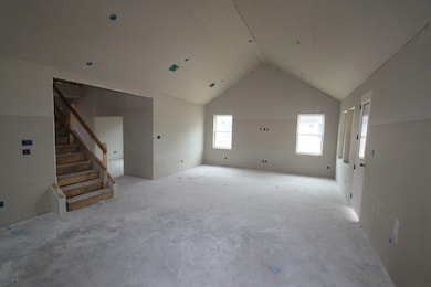 Open great room with high vaulted ceilings - still