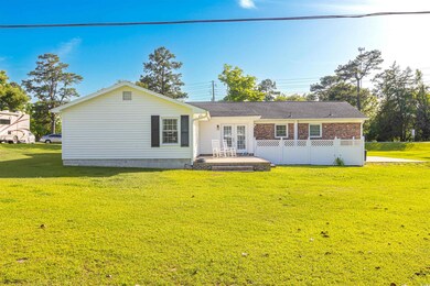 Rear view of house with french doors
