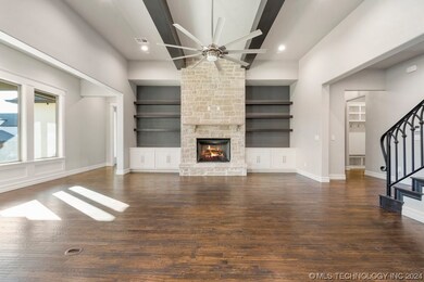 The living area features a floor to ceiling stone