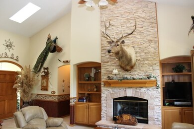 Large stone double sided fireplace, vaulted ceilin