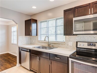 Kitchen featuring stainless steel appliances, ligh