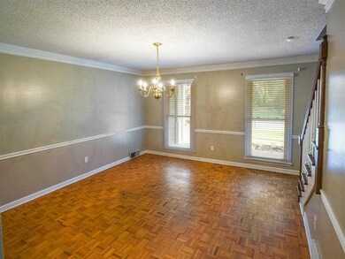Formal dining room w/ parquet flooring