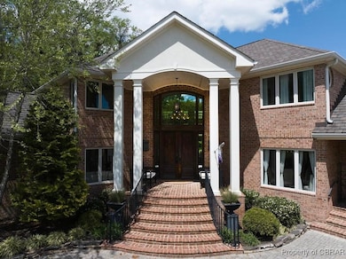Property entrance featuring brick siding