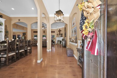 Upon entering the foyer, you are welcomed by the expansive high ceilings and the open layout.