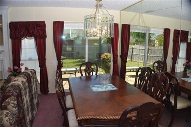 Dining room with mirrored wall and window to let i