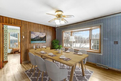 Formal dining room, virtually staged.