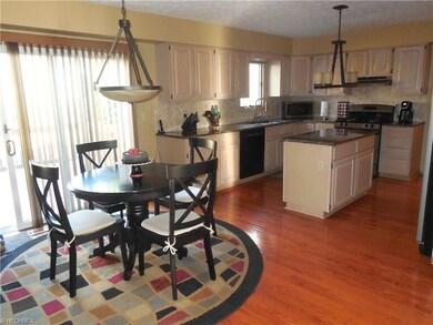 Kitchen with hardwood flooring and granite counter