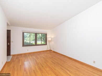 Hardwood floors in main level living room are in e