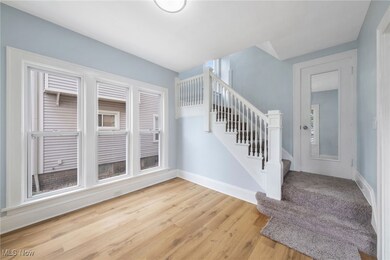 Foyer with light hardwood / wood-style flooring