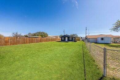 View of yard featuring an outdoor structure and a