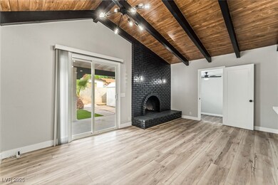 Unfurnished living room featuring baseboards, loft