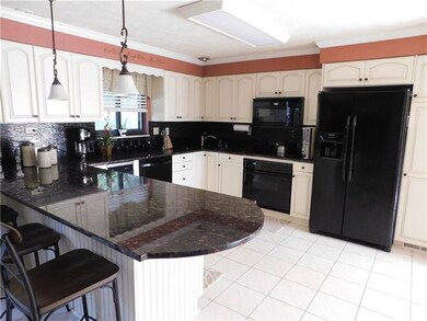 The updated kitchen is stunning with the granite c