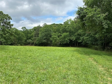 View of yard featuring a view of trees
