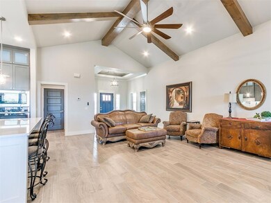 Living room featuring ceiling fan with notable cha
