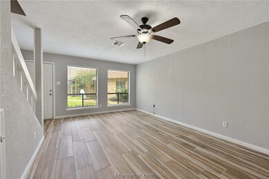 Living room has updated tile flooring & recent pai