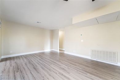 Empty room featuring light wood-style flooring and baseboards